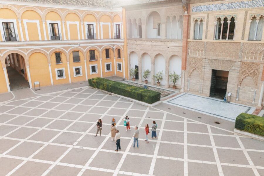 Seville: Guided Walking Tour with Alcazar & Cathedral Access - Santa Cruz walk: medieval lanes and Jewish Quarter stories